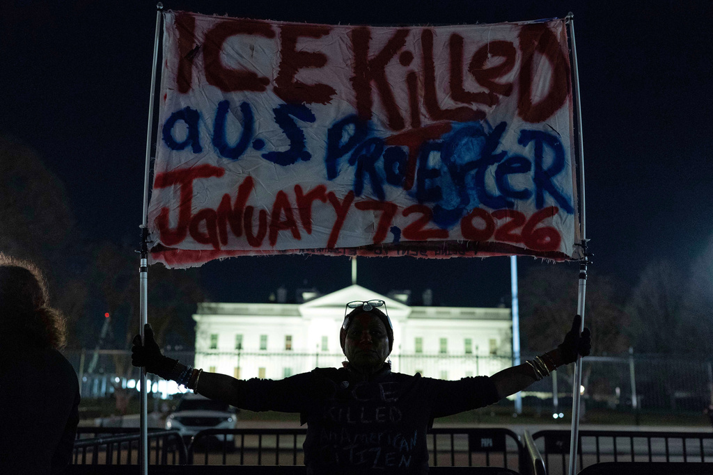 Demonstrators protest at the White House in Washington, Thursday, Jan. 8, 2026, against the Immigration and Customs Enforcement (ICE) agent who fatally shot Renee Nicole Good in Minneapolis. (AP Photo/Jose Luis Magana)