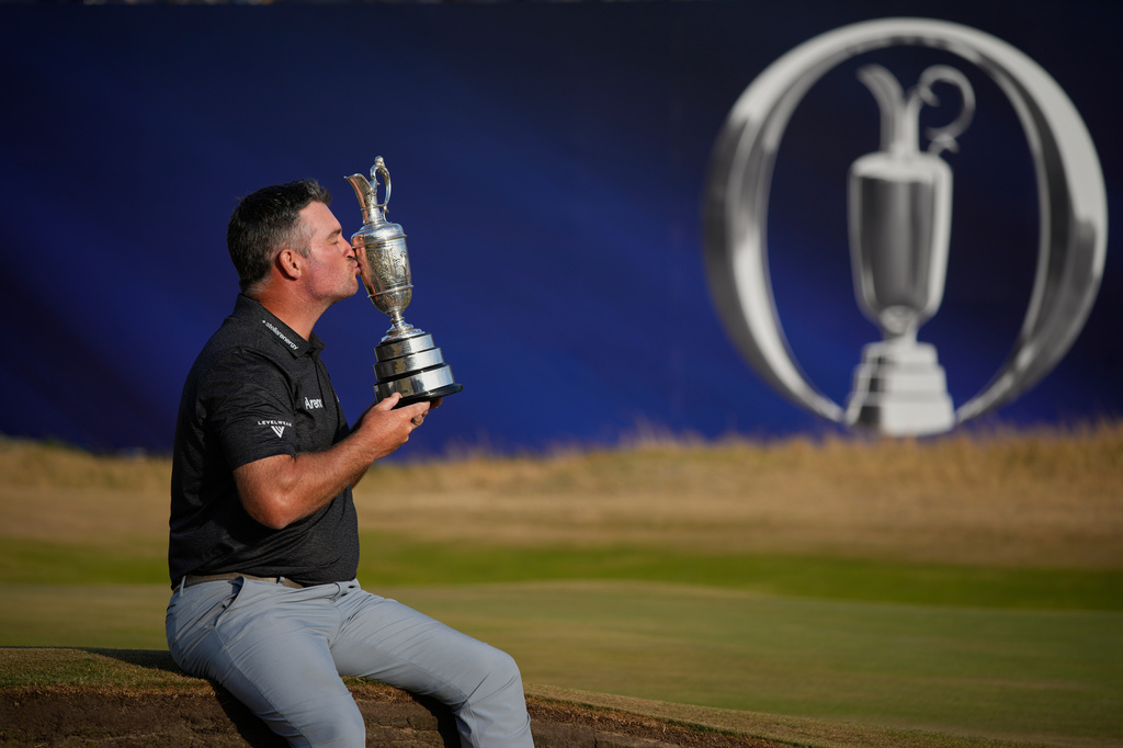 Ryan Fox of New Zealand poses with the Claret Jug trophy after winning the British Open Golf championships at Royal Birkdale golf club, in Southport, England, Sunday, July 19, 2026. (AP Photo/David Goldman)