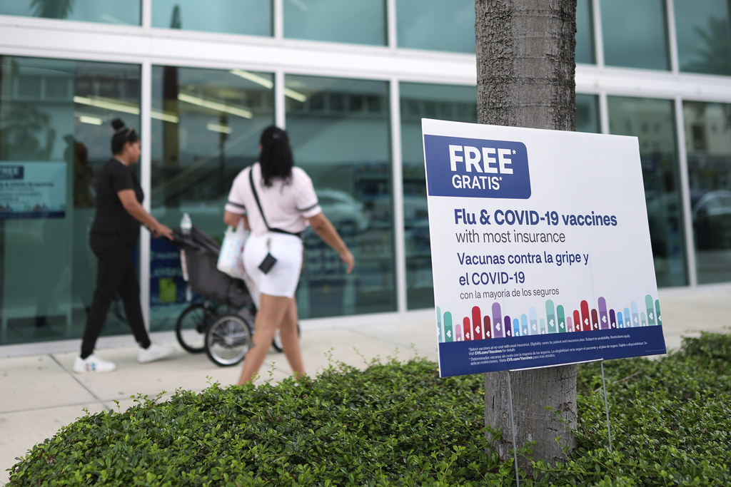 Vaccines are advertised outside a pharmacy in Miami, Thursday, Sept. 4, 2025. (AP Photo/Rebecca Blackwell)
