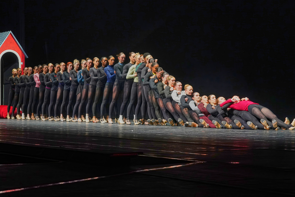 The Rockettes rehearse the "Parade of the Wooden Soldiers," a number in which the costumed dancers march in military-like precision and then famously collapse like dominoes, in the Christmas Spectacular at Radio City Music Hall, in New York, Thursday, Oct. 30, 2025. (AP Photo/Richard Drew)