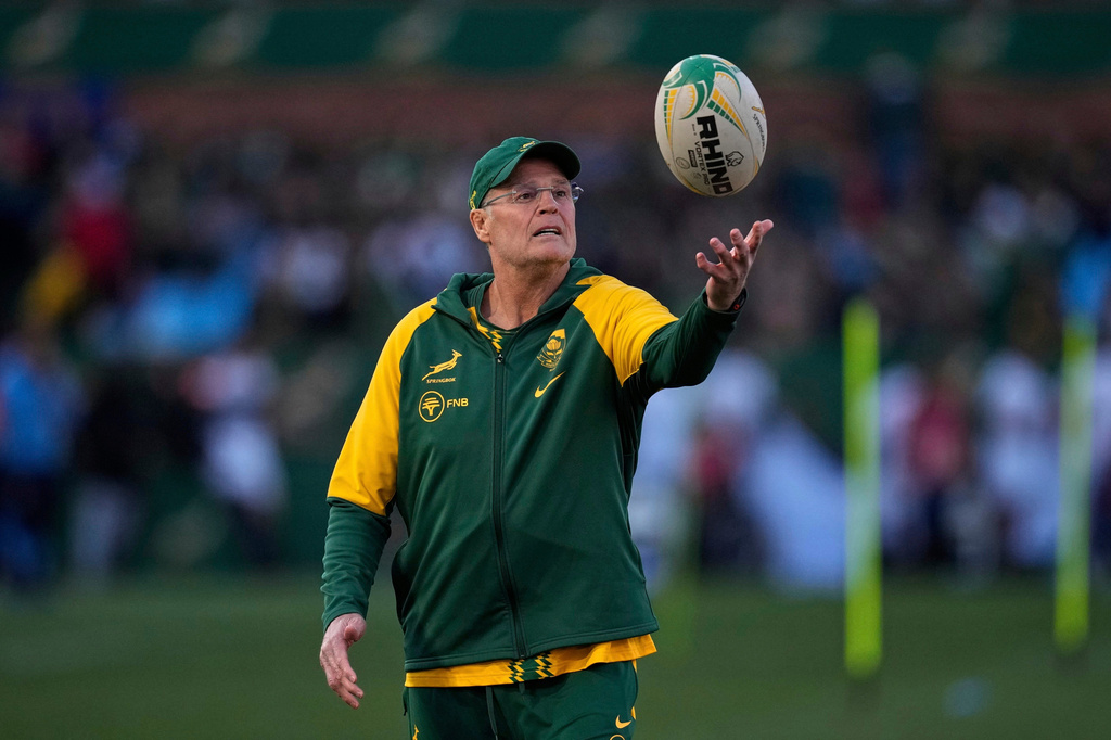 FILE - South Africa's head coach Rassie Erasmus juggles the ball as players warm up for the match ahead of a rugby championship test match between South Africa and Italy at Loftus Versfeld stadium in Pretoria, South Africa, July 5, 2025. (AP Photo/Themba Hadebe, File)