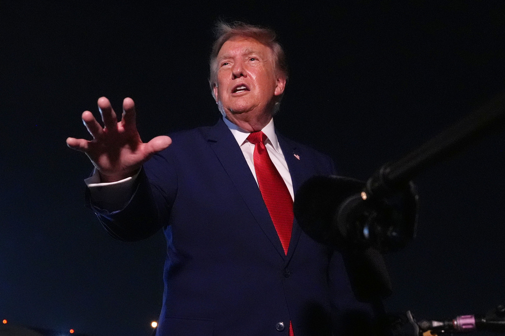President Donald Trump talks to reporters after arriving on Air Force One Tuesday, Aug. 11, 2026, at Joint Base Andrews, Md. (AP Photo/Mark Schiefelbein)