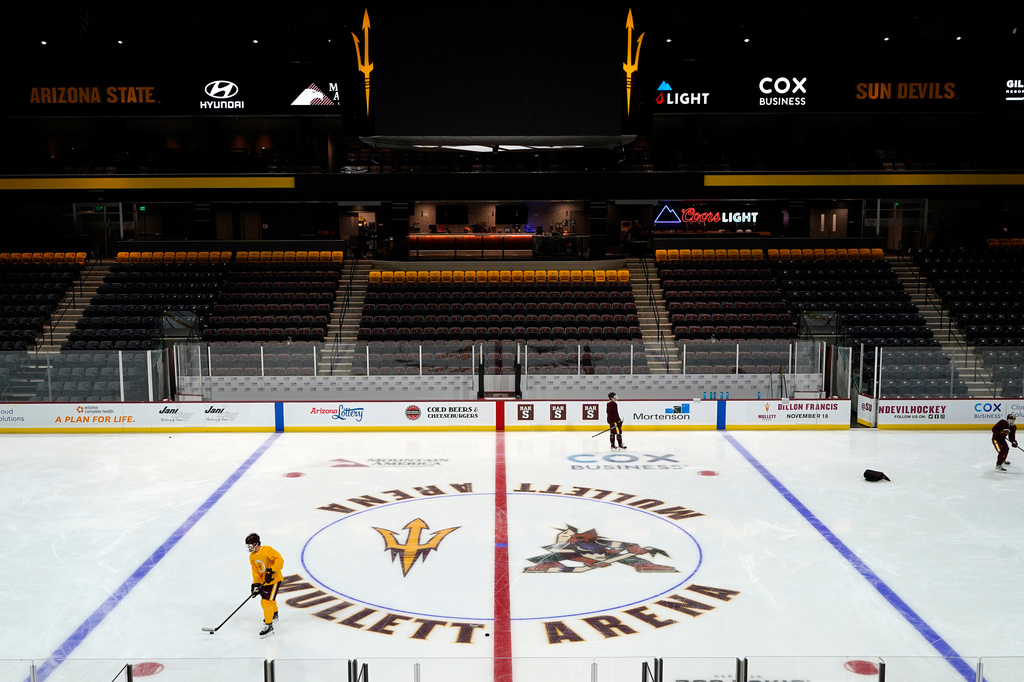FILE - Members of the Arizona State University hockey team skate on the ice at the new Mullett Arena, Oct. 24, 2022, in Tempe, Ariz. (AP Photo/Ross D. Franklin, File)