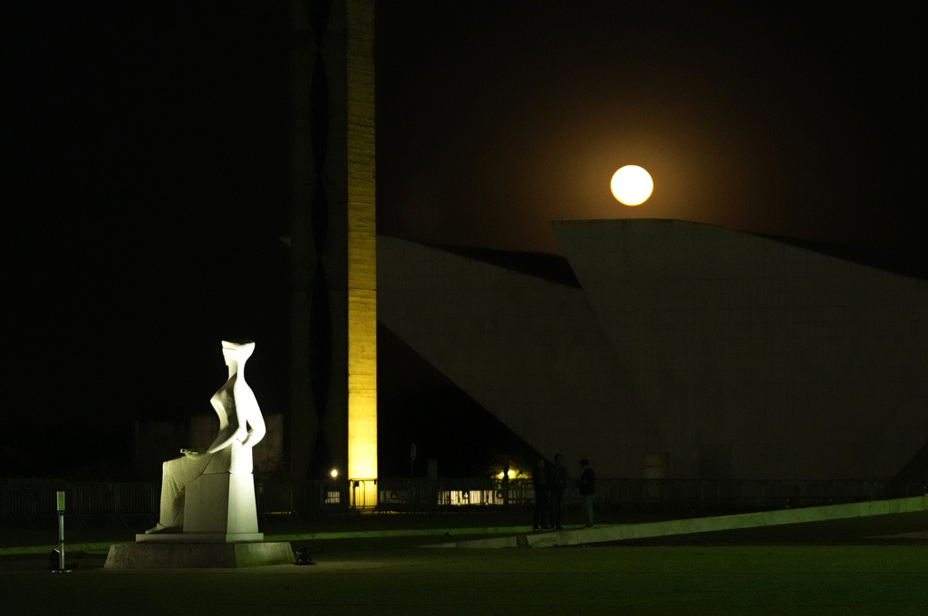 The moon rises over the Supreme Court, a day before former President Jair Bolsonaro's trial, in Brasilia, Brazil, Monday, Sept. 8, 2025. (AP Photo/Eraldo Peres)