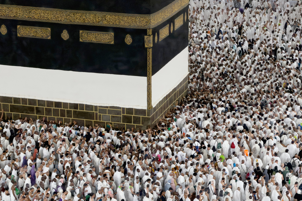 Muslim pilgrims circumambulate the Kaaba, Islam's holiest site at the Grand Mosque, during the annual Hajj pilgrimage in Mecca, Saudi Arabia, Friday, May 22, 2026. (AP Photo/Altaf Qadri)