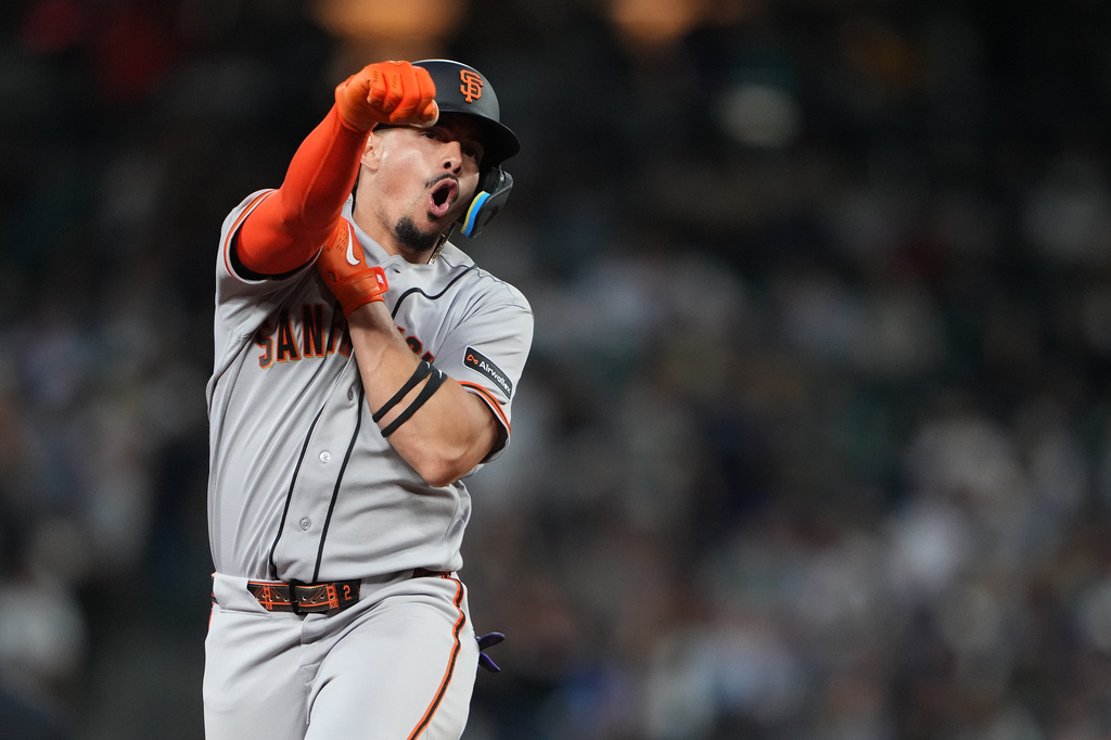 San Francisco Giants' Willy Adames celebrates while jogging the bases after hitting a grand slam against the Seattle Mariners during the seventh inning of a baseball game, Friday, July 17, 2026, in Seattle. (AP Photo/Lindsey Wasson)