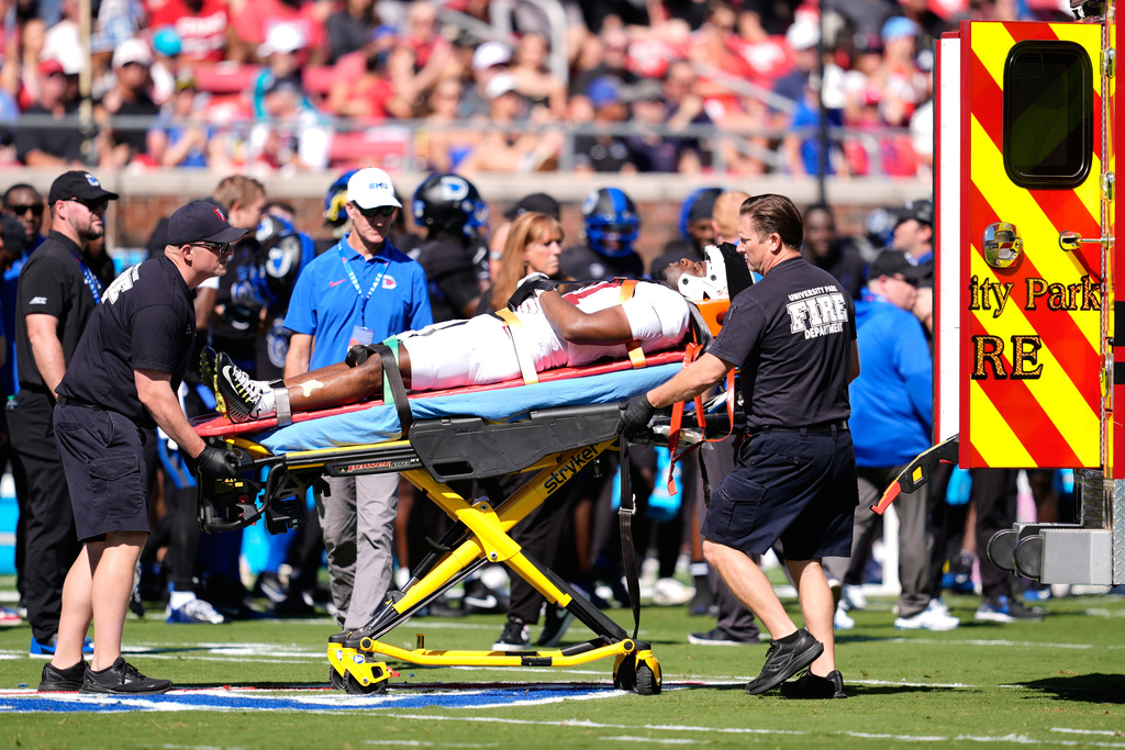Stanford cornerback Aaron Morris is carted off the field and on to an ambulance after suffering an unknown injury in the first half of an NCAA college football game against SMU, Saturday, Oct. 11, 2025, in Dallas. (AP Photo/Tony Gutierrez)