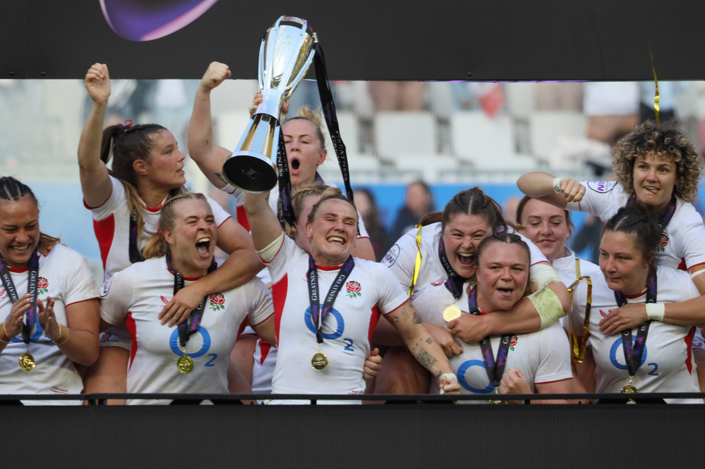 England's captain Megan Jones holds the trophy aloft after her team won the Six Nations rugby union match between France and England in Bordeaux, Sunday, May 17, 2026. (AP Photo/Yohan Bonnet)