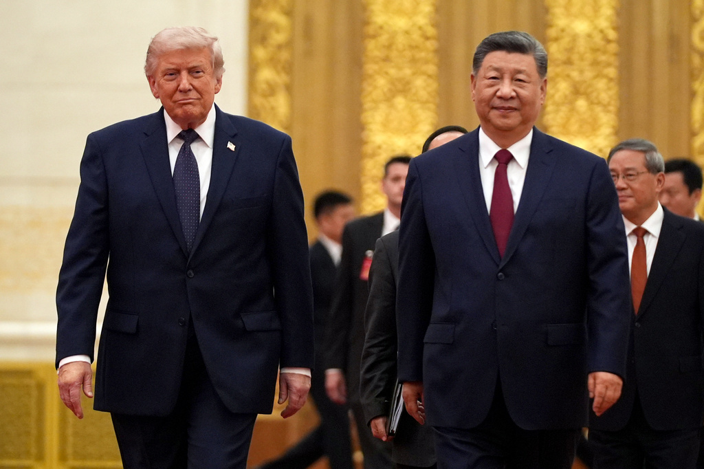 FILE - President Donald Trump, left, and Chinese President Xi Jinping arrive during a state dinner at the Great Hall of the People, May 14, 2026, in Beijing. (AP Photo/Mark Schiefelbein, File)