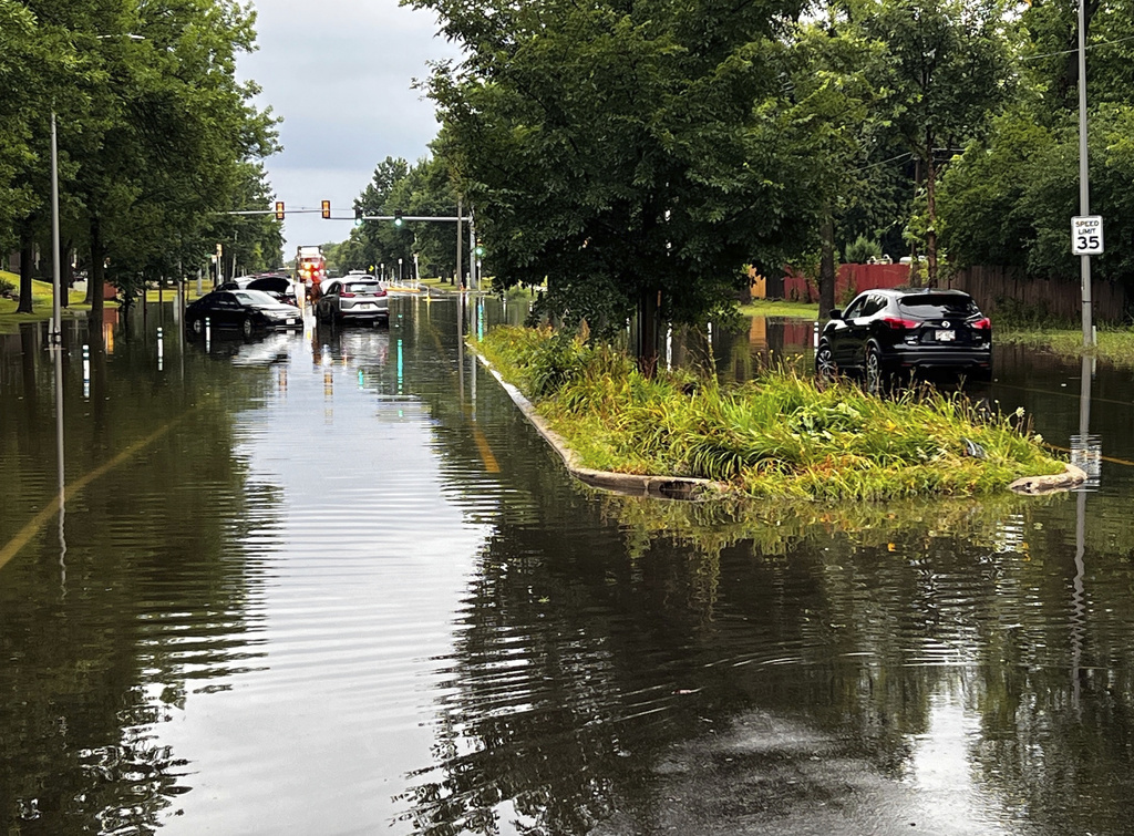 CORRECTION - CORRECTS SOURCE TO CBS58 NOT CBS28. This image provided by CBS58 (WDJT) shows idle cars in a flooded street in Milwaukee, Sunday, Aug. 10, 2025. (CBS58 (WDJT) via AP)