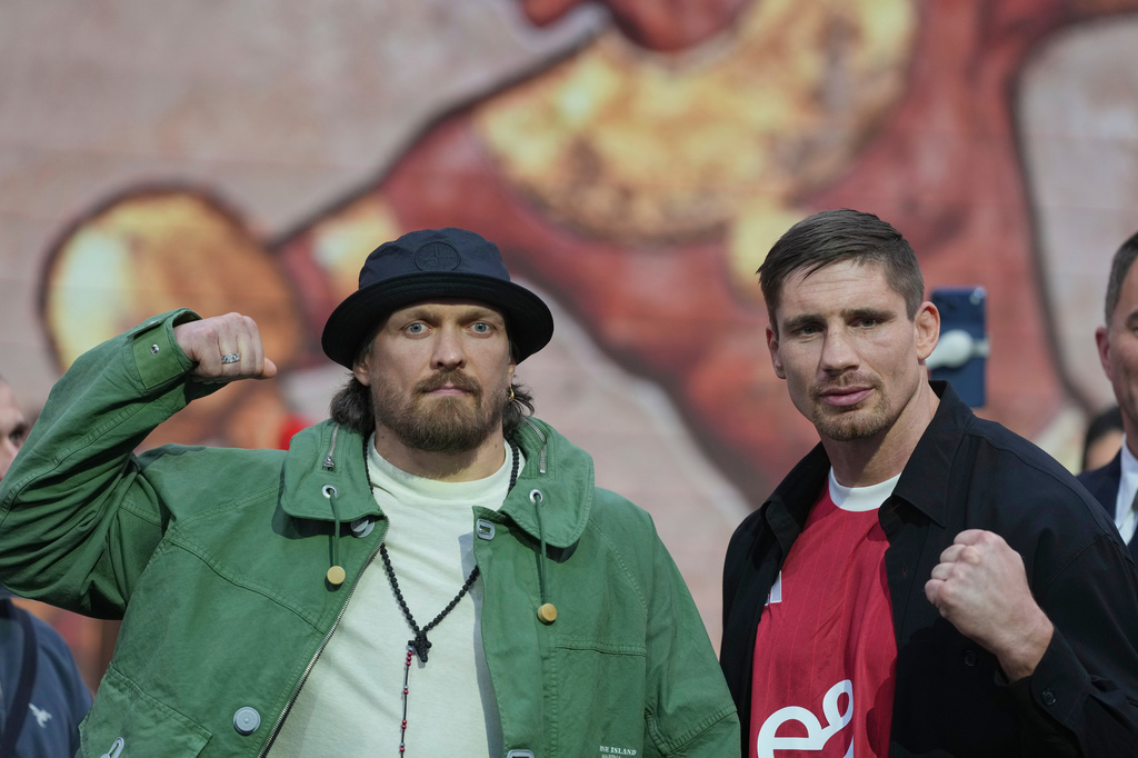FILE -Boxers Oleksandr Usyk, left, and Rico Verhoeven face off during a press conference to announce their upcoming WBC World Heavyweight Championship boxing match, in London, April 14, 2026. (AP Photo/Alastair Grant, File)