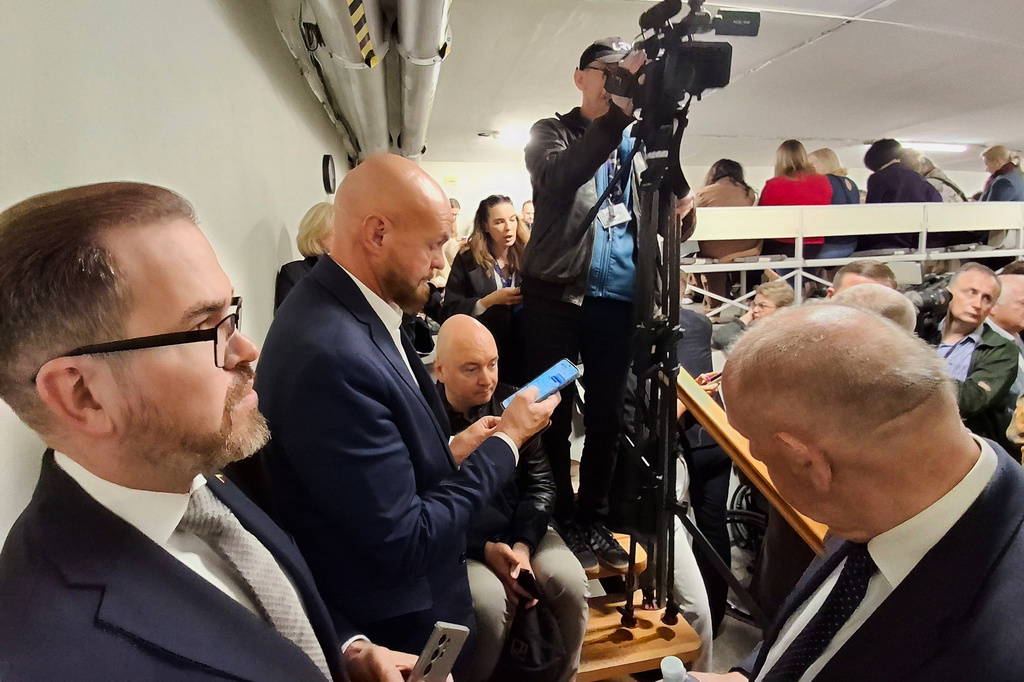Following an air raid alert members of parliament and media representatives gather in a shelter at the parliament building in Vilnius, Lithuania, Wednesday, May 20, 2026. (Zygimantas Pavilionis via AP)
