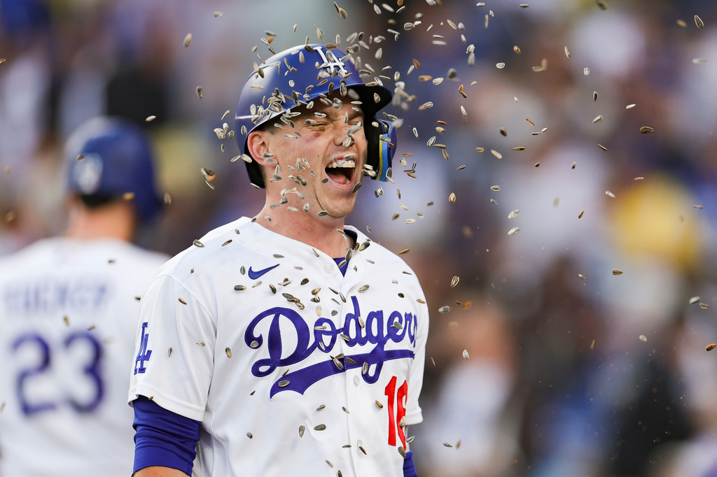 Los Angeles Dodgers designated hitter Will Smith has sunflower seeds thrown at him after hitting a solo home run during the first inning of a baseball game against the San Francisco Giants, Thursday, May 14, 2026, in Los Angeles. (AP Photo/Ryan Sun)