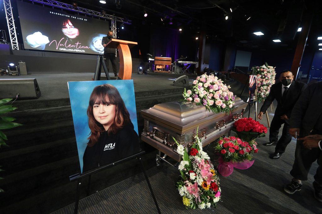 FILE - The casket containing 14-year-old Valentina Orellana-Peralta, killed on Dec. 23, 2021, by a LAPD police officer's stray bullet while shopping with her mother, is readied for her funeral at the City of Refuge Church in Gardena, Calif., Jan. 10, 2022. (AP Photo/David Swanson, File)