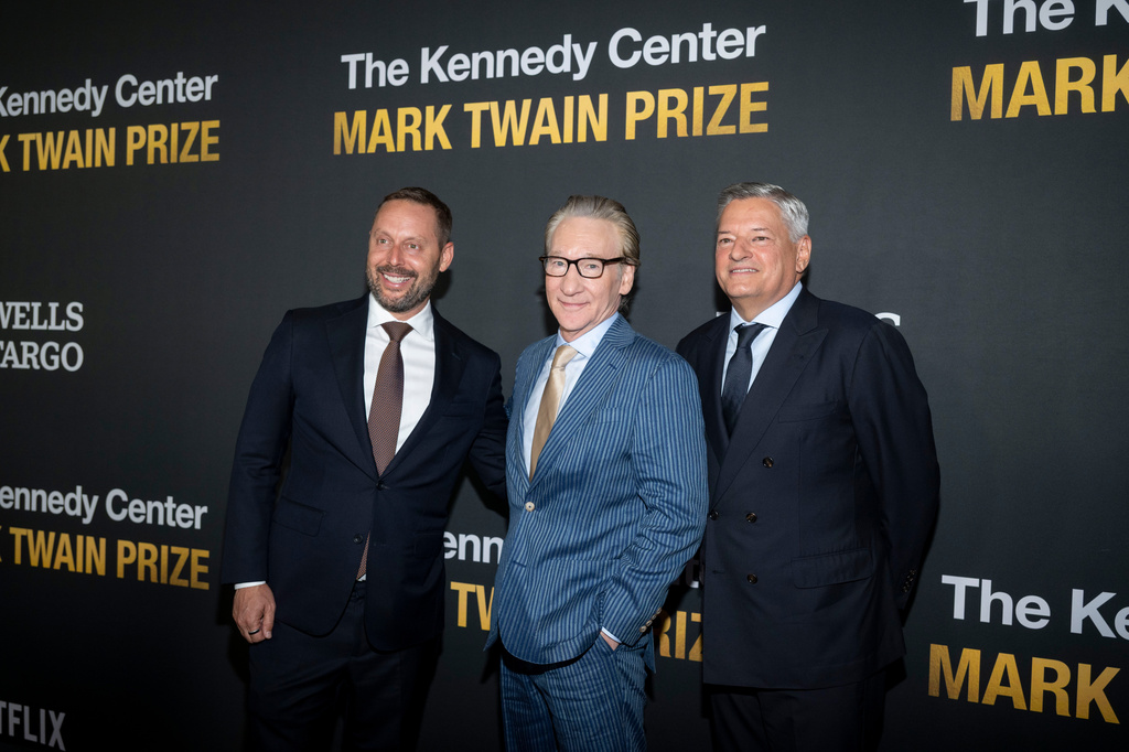 From left, Michael Kives, Comedian and political satirist Bill Maher, and Ted Sarandos pose on the red carpet for the 27th Annual Mark Twain Prize for American Humor Celebrating Bill Maher, Sunday, June 29, 2026, in Washington. (AP Photo/Kevin Wolf)