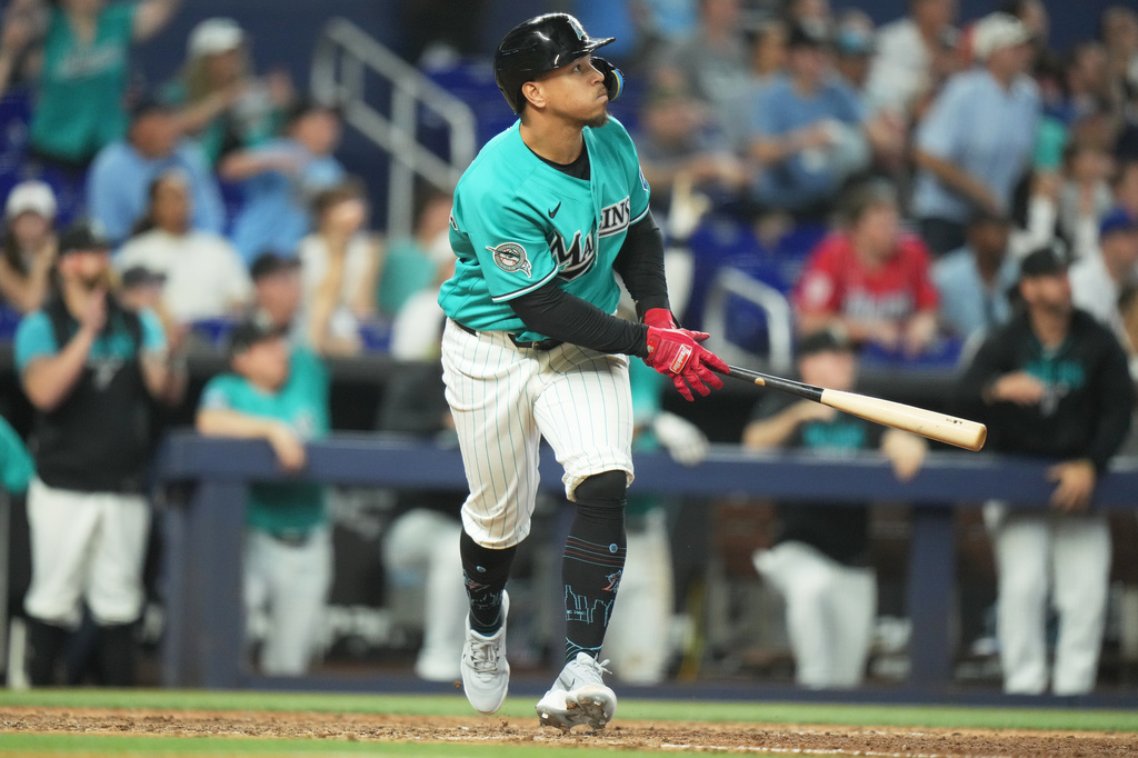 Miami Marlins' Heriberto Hernández watches after hitting a walk-off grand slam in the ninth inning to defeat the New York Mets in a baseball game, Sunday, May 24, 2026, in Miami. (AP Photo/Lynne Sladky)