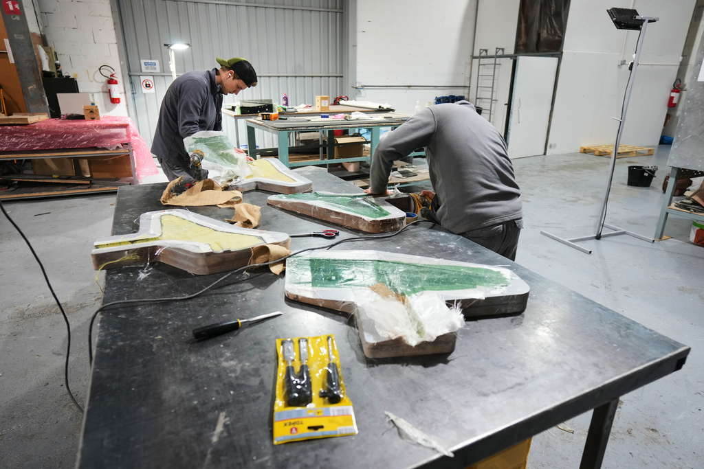 Employees work on a drone at a drone manufacturing factory in Limassol, Cyprus, Tuesday, Jan. 27, 2026. (AP Photo/Petros Karadjias)