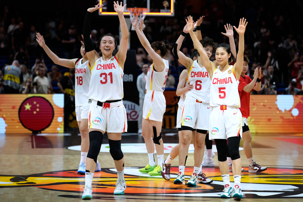 China players celebrate after the Women's Basketball World Cup match between Czechia and China in Berlin, Sunday, Sept. 6, 2026. (AP Photo/Ebrahim Noroozi)