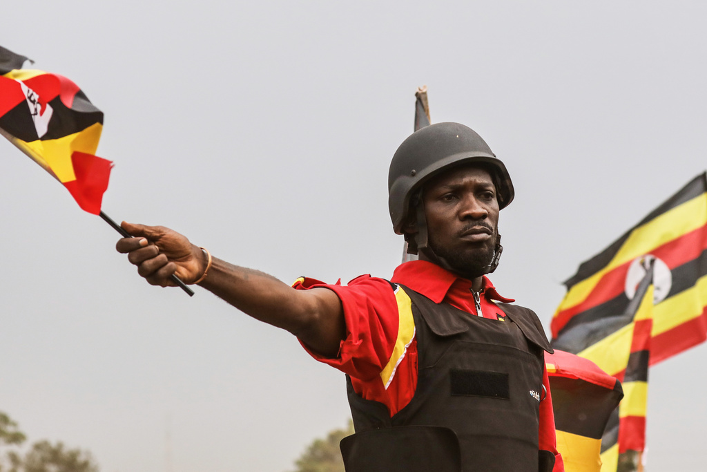 FILE - Uganda opposition presidential candidate Robert Kyagulanyi Ssentamu who is known as Bobi Wine waves to supporters at an election campaign rally in Mukono, Uganda, Friday, Jan. 9, 2026. (AP Photo/Hajarah Nalwadda, File)