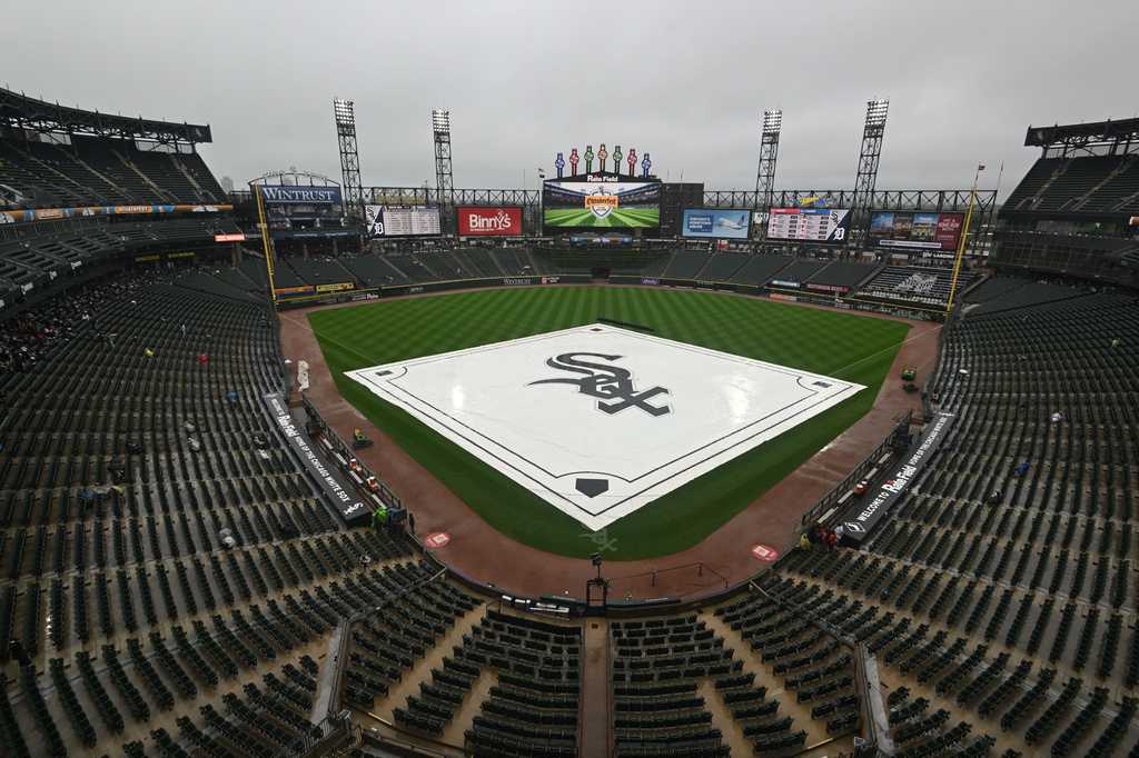 A tarp covers the field during a rain delay before a baseball game between the Chicago White Sox and the Detroit Tigers, Sunday, Sept. 20, 2026, in Chicago. (AP Photo/Paul Beaty)