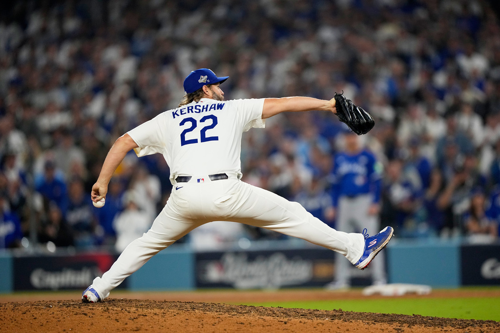 Los Angeles Dodgers pitcher Clayton Kershaw throws against the Toronto Blue Jays in the 12th inning in Game 3 of baseball's World Series, Monday, Oct. 27, 2025, in Los Angeles. (AP Photo/Brynn Anderson)