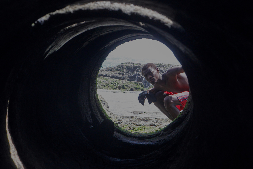 A man looks into a tunnel at the port in Mogadishu, Somalia, Thursday, Jan. 8, 2026. (AP Photo/Farah Abdi Warsameh)