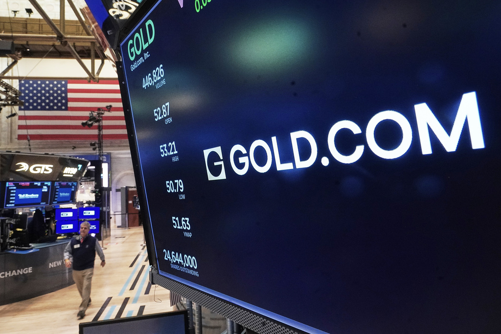 The logo for Gold.com is displayed above a trading post on the floor of the New York Stock Exchange, Tuesday, Feb. 3, 2026. (AP Photo/Richard Drew)