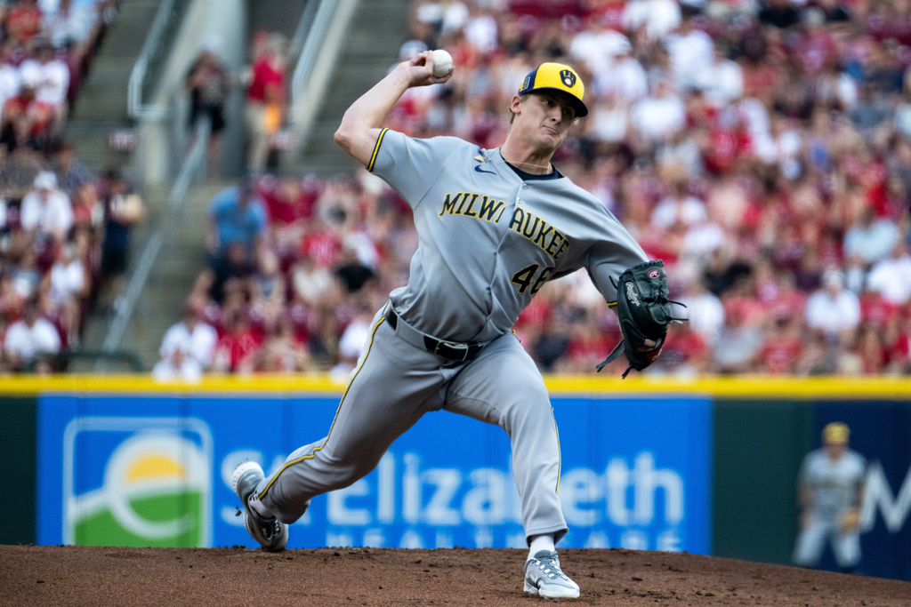 Milwaukee Brewers pitcher Quinn Priester delivers a pitch in the first inning of a baseball game against the Cincinnati Reds, Saturday, Aug. 16, 2025, in Cincinnati. (AP Photo/Michael Swensen)