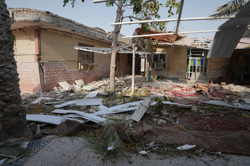 Debris is scattered across the courtyard of a building that Iranian media said was hit by a U.S. strike while a wedding celebration was taking place there, in Kuhestak, southern Iran, Wednesday, Sept. 2, 2026. (Morteza Akhoondi/Tasnim News Agency via AP)