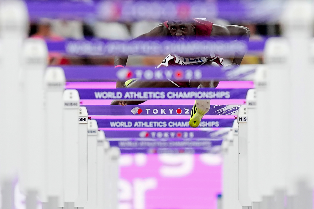 Qatar's Oumar Doudai Abakar competes in a men's 110 meters hurdles heat at the World Athletics Championships in Tokyo, Sept. 15, 2025. (AP Photo/Petr David Josek, File)