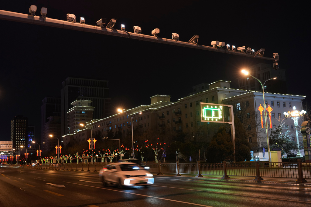 CCTV cameras are lined up on a pole along a road in Beijing, Tuesday, Feb. 4, 2025. (AP Photo/Aaron Favila)