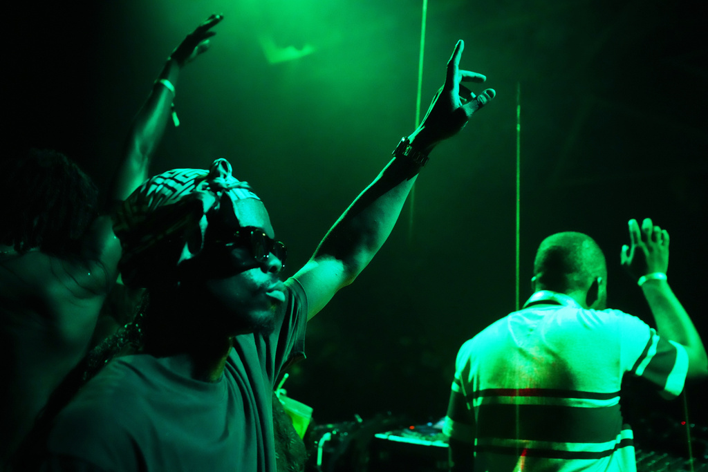 People dance to house music during a Group Therapy rave in Lekki, an upscale part of Lagos, Nigeria, early Saturday, Feb. 28, 2026. (AP Photo/Sunday Alamba)