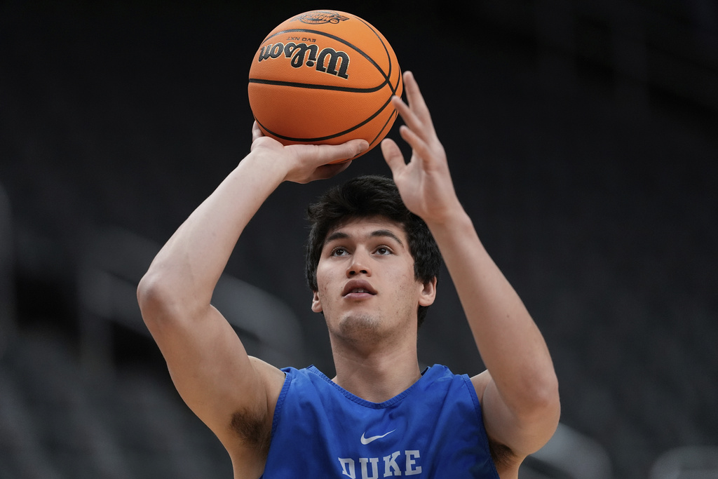 FILE - Duke center Stanley Borden shoots during a practice ahead of a Sweet 16 game against Arizona in the NCAA college basketball tournament, Wedensday, March 26, 2025, in Newark, N.J. (AP Photo/Julia Demaree Nikhinson, File)
