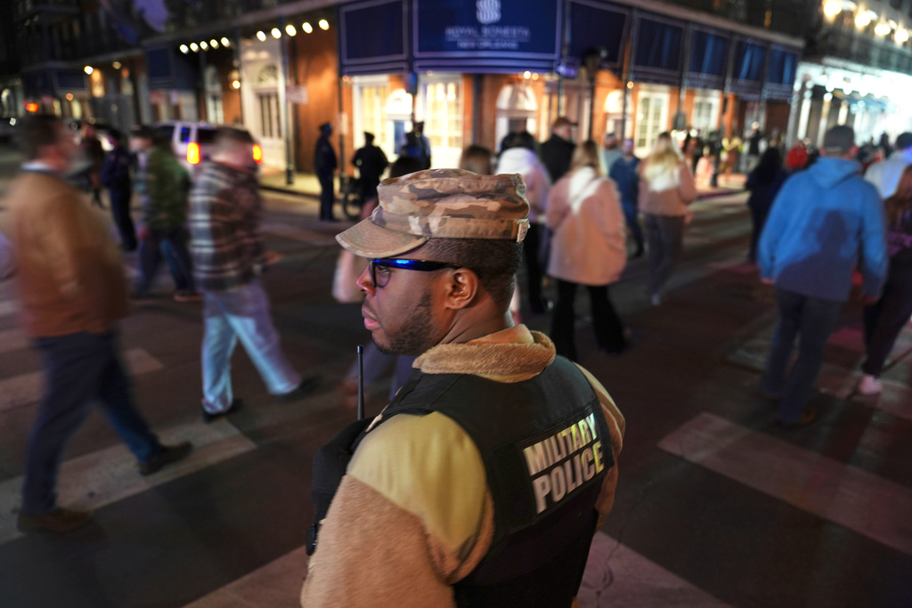 FILE - Spc. Nelson Harrison, of the Louisiana National Guard, stands guard on Bourbon Street in the French Quarter, Jan. 2, 2025, in New Orleans. (AP Photo/George Walker IV, File)