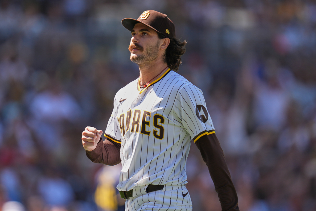 FILE - San Diego Padres starting pitcher Dylan Cease celebrates after the third out during the third inning of a baseball game against the Milwaukee Brewers, Sept. 24, 2025, in San Diego. (AP Photo/Gregory Bull, File)