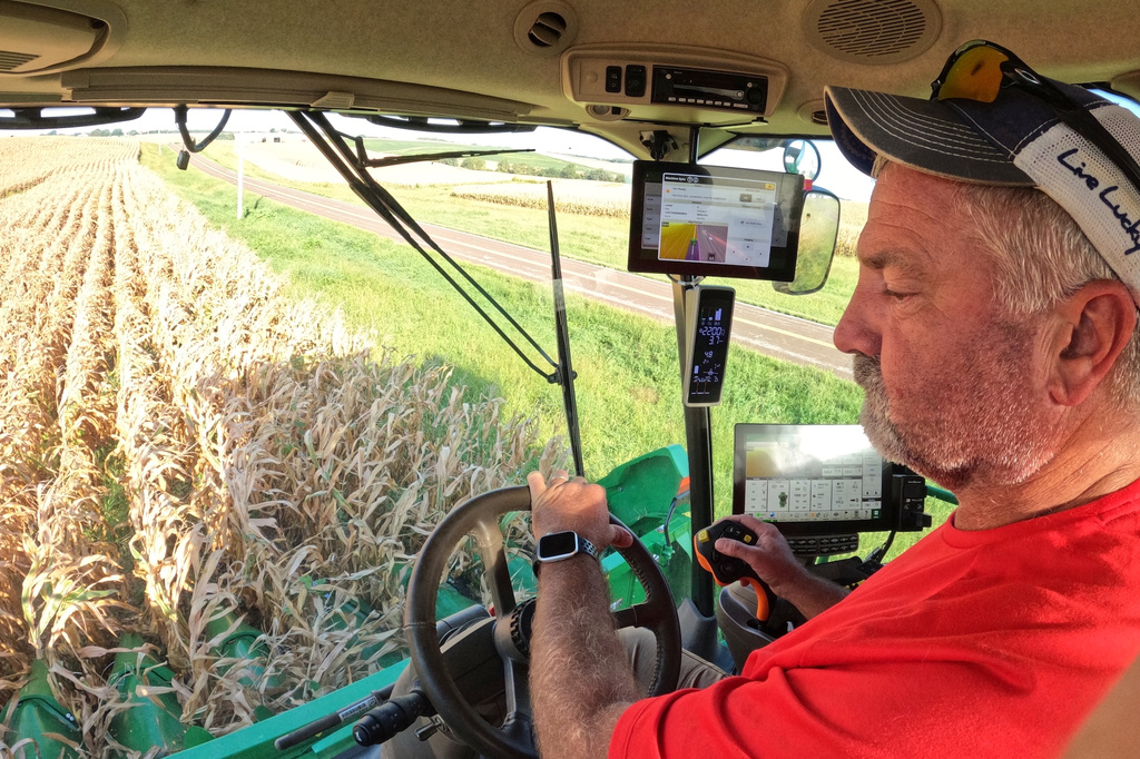 Farmer Jason Kurtz harvests corn Tuesday, Sept. 8, 2026, near Forest City, Mo. (AP Photo/Nick Ingram)