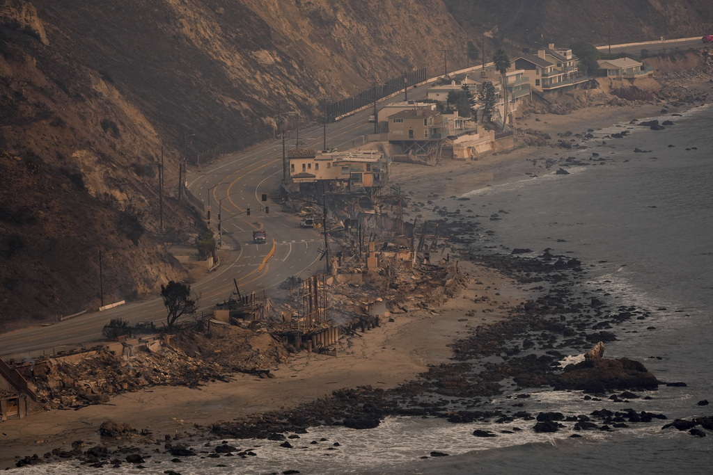 Beach front properties are left destroyed by the Palisades Fire, in this aerial view, Thursday, Jan. 9, 2025 in Malibu, Calif. (AP Photo/Mark J. Terrill)
