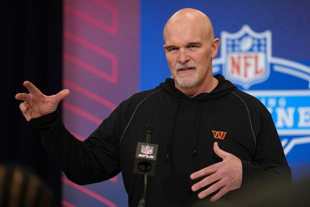 Washington Commanders head coach Dan Quinn speaks during a press conference at the NFL football scouting combine in Indianapolis, Tuesday, Feb. 24, 2026. (AP Photo/Michael Conroy)