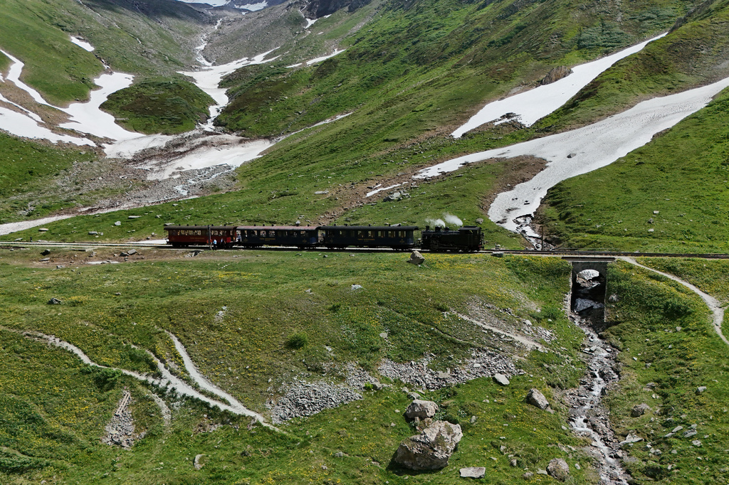 A steam train makes his way near the Muttbach-Belvedere station near Realp, Switzerland, Friday, June 26, 2026. (AP Photo/Niccolo Lupone)