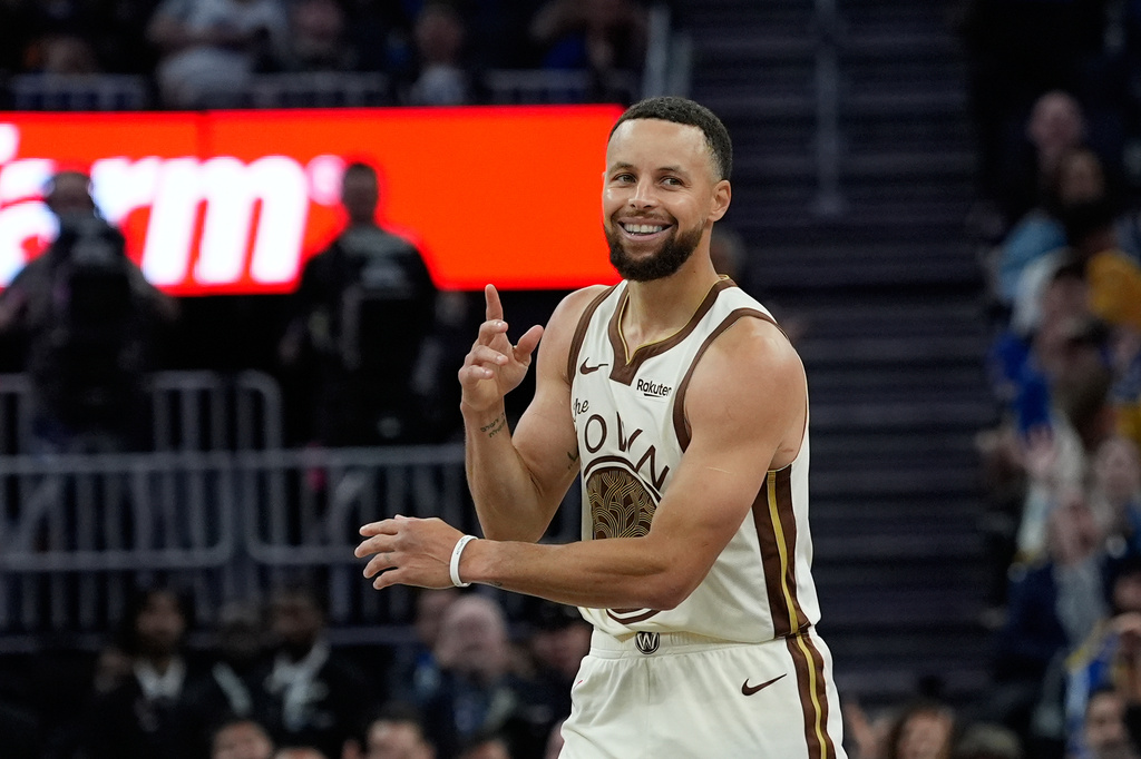 FILE - Golden State Warriors guard Stephen Curry reacts after making a 3-point basket during the second half of an NBA basketball game against the Sacramento Kings, Tuesday, April 7, 2026, in San Francisco. (AP Photo/Godofredo A. Vásquez, File)