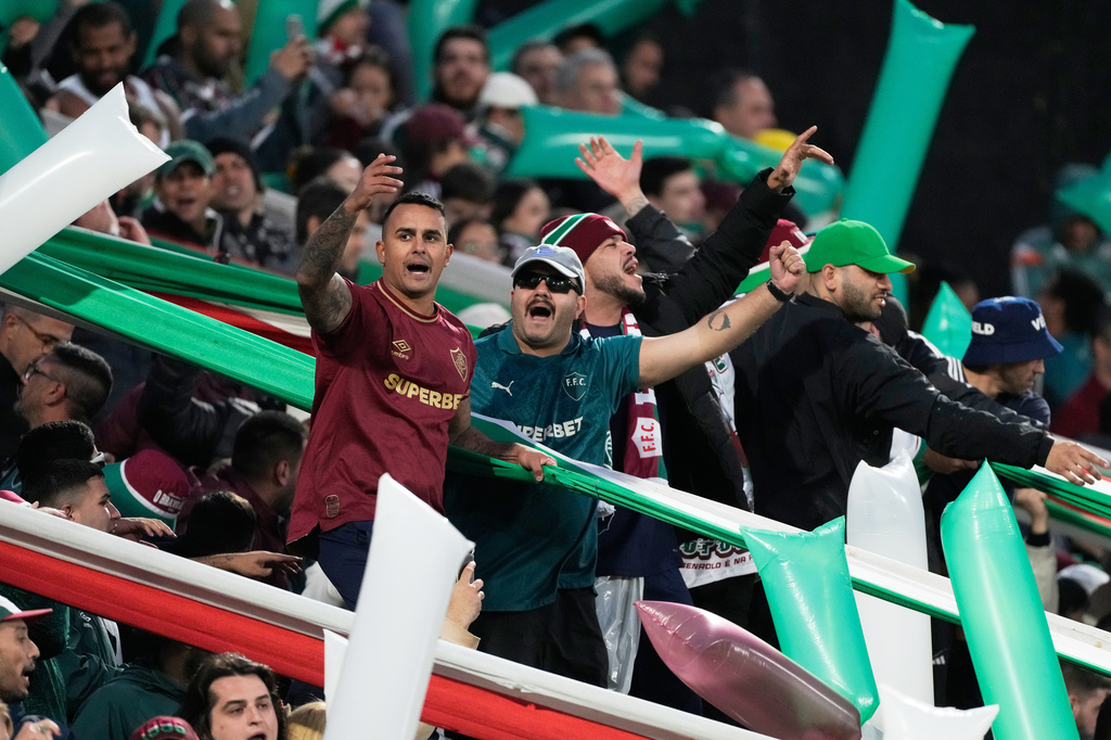 Fans of Brazil's Fluminense cheer prior to a Copa Libertadores quarter final second leg soccer match against Argentina's Platense in Buenos Aires, Argentina, Tuesday, Sept. 15, 2026. (AP Photo/Gustavo Garello)