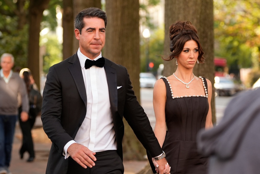 Jesse Watters, left, and his wife Emma DiGiovine walk to the White House to attend a state dinner hosted for China's President Xi Jinping, Thursday, Sept. 24, 2026, in Washington. (AP Photo/Carolyn Kaster)
