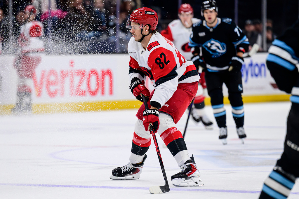 Carolina Hurricanes center Jesperi Kotkaniemi (82) skates with the puck during the first period of an NHL hockey game against the Utah Mammoth, Saturday, April 11, 2026, in Salt Lake City. (AP Photo/Tyler Tate)