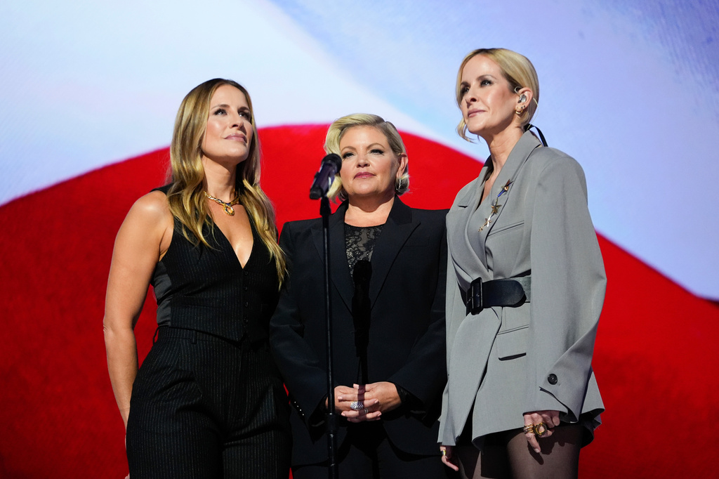 FILE - Emily Robison, from left, Natalie Maines and Martie Maguire, of The Chicks, sing the national anthem at the 2024 Democratic National Convention in Chicago on Aug. 22, 2024. (AP Photo/Paul Sancya, File)