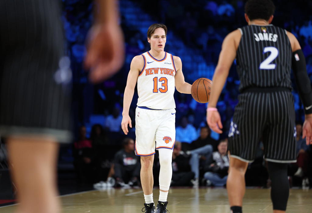 New York Knicks guard Tyler Kolek (13) dribbles the ball during the first half of an NBA Cup semifinals basketball game against the Orlando Magic, Saturday, Dec. 13, 2025, in Las Vegas. (AP Photo/Ronda Churchill)