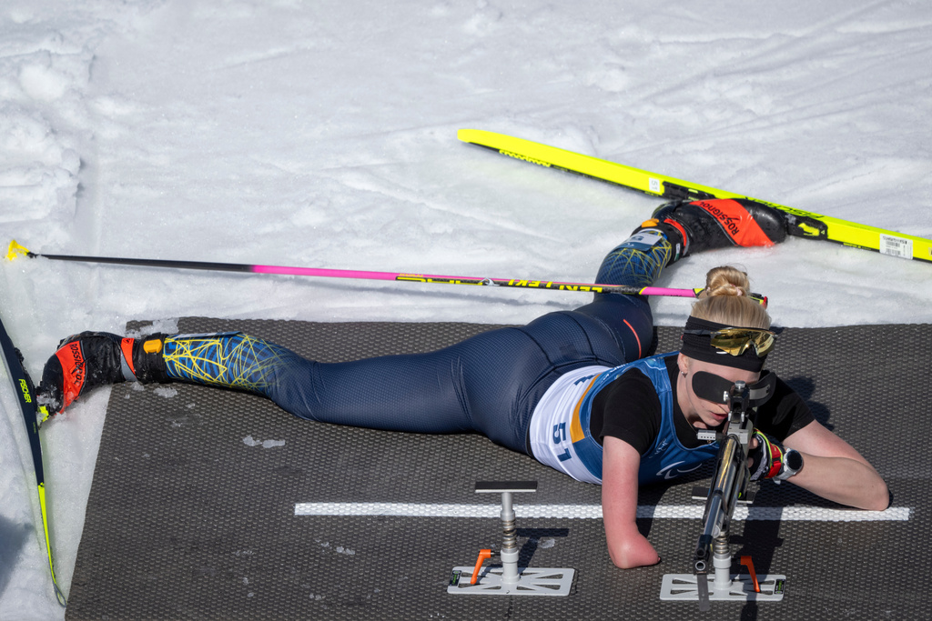 Ukraine's Bohdana Konashuk competes on the shooting range during the Para Biathlon Women's Individual Standing competition at the 2026 Winter Paralympics, in Tesero, Italy, Sunday March 8, 2026. (Joel Marklund/OIS/IOC via AP)