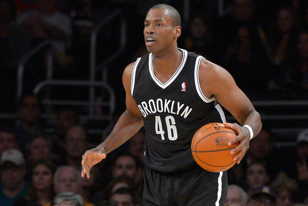 FILE - Brooklyn Nets center Jason Collins dribbles the ball during the second half of an NBA basketball game against the Los Angeles Lakers, Sunday, Feb. 23, 2014, in Los Angeles. (AP Photo/Mark J. Terrill, File)