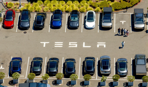 FILE - Tesla vehicles line a parking area at the company's Fremont, Calif., factory on Tuesday, Aug. 5, 2025. (AP Photo/Noah Berger, File) FILE - Tesla vehicles line a parking area at the company's Fremont, Calif., factory on Tuesday, Aug. 5, 2025. (AP Photo/Noah Berger, File)