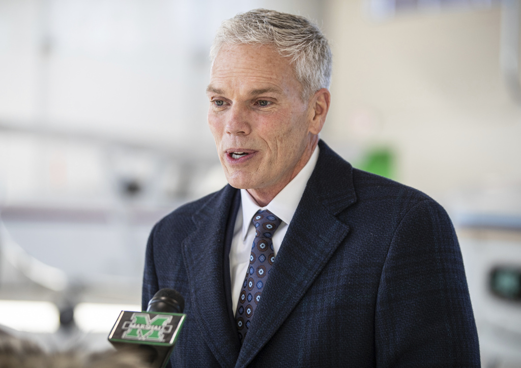 FILE - Marshall University President Brad Smith speaks with members of the media, Jan. 26, 2022, at the Huntington Tri-State Airport, in Huntington, W.Va. (Sholten Singer/The Herald-Dispatch via AP, file)
