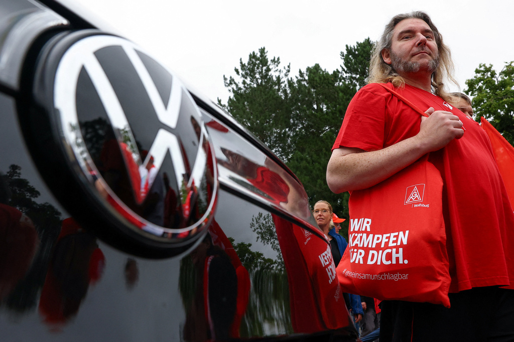 Employees of carmaker Volkswagen AG and IG Metall union members rally on the grounds of the Volkswagen headquarters on the day of the supervisory board meeting, in Wolfsburg, Germany, Thursday, July 9, 2026. (Lisi Niesner/Pool Photo via AP)